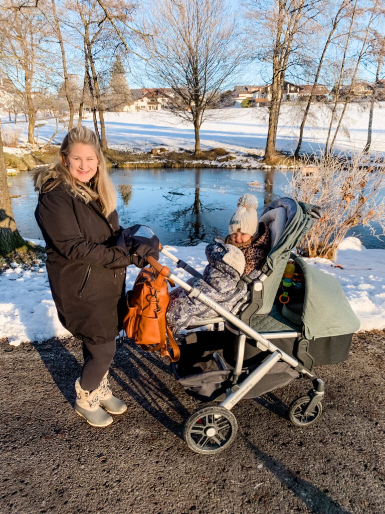 mom outside with double stroller uppababy vista