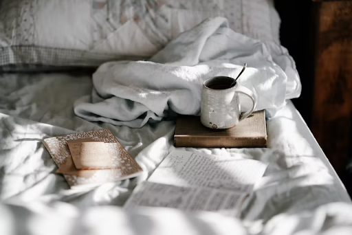 Coffee cup on bed