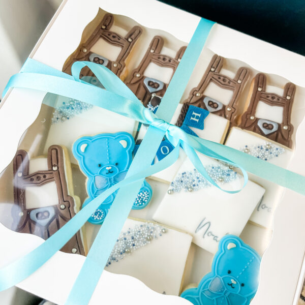 Baby shower cookies in box with bow.