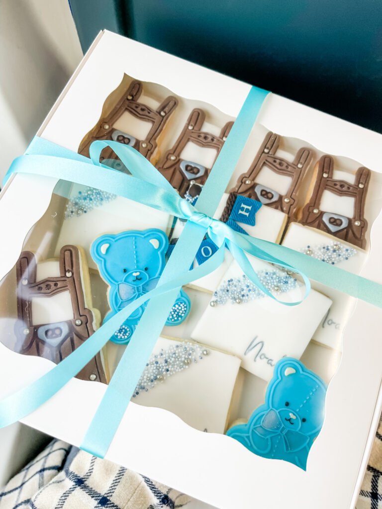 Baby shower cookies in box with bow.