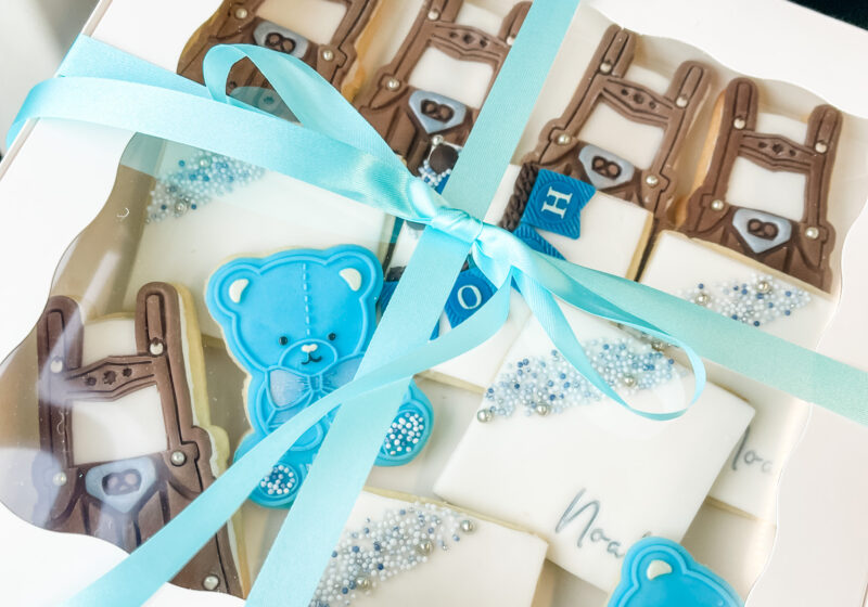 Baby shower cookies in box with bow.