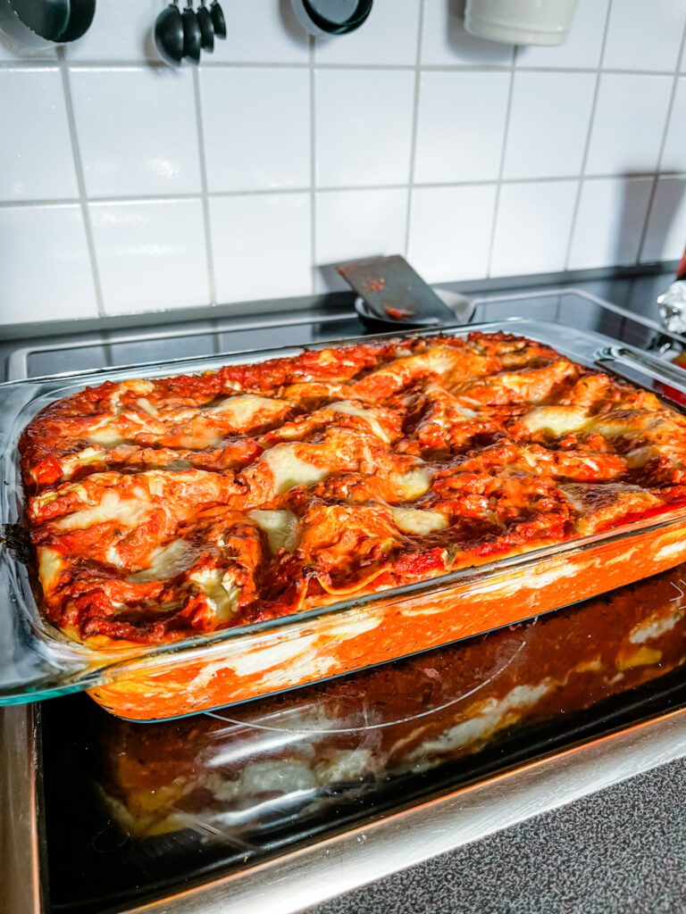 Lasagna on stove for cooking at home. 