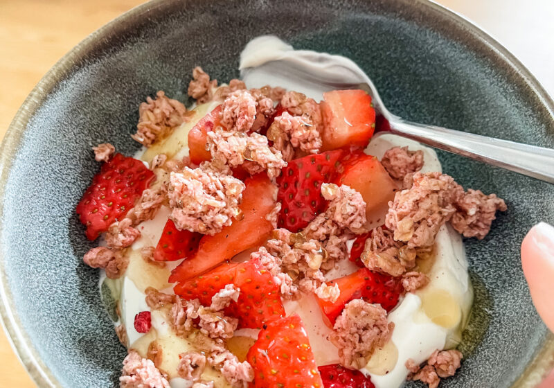 Yogurt parfait in bowl with spoon for cooking at home.