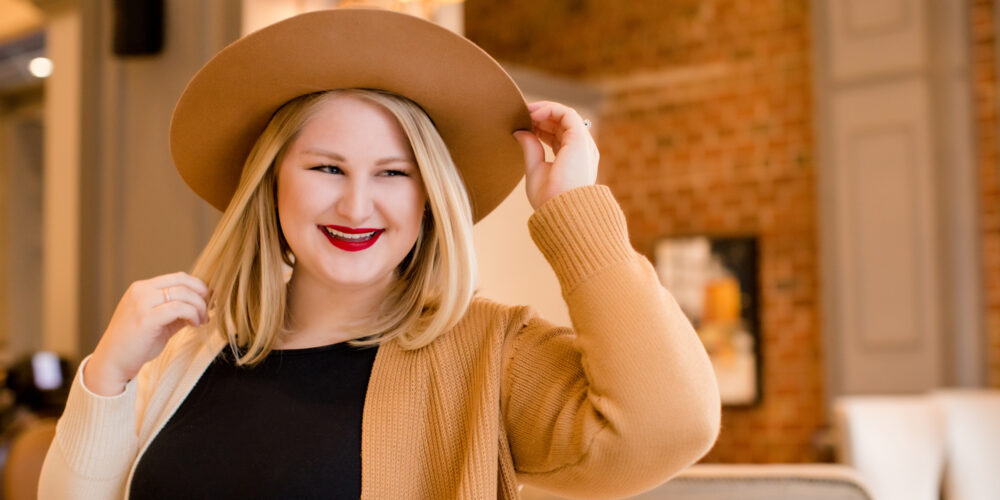 Blonde girl in hat.