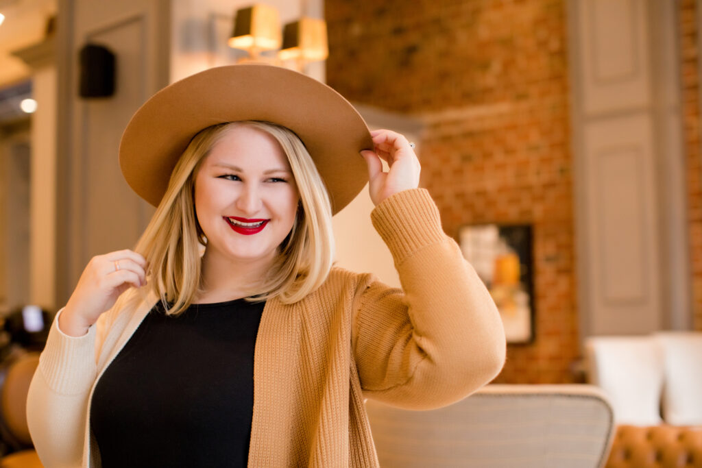 Blonde girl in hat. 