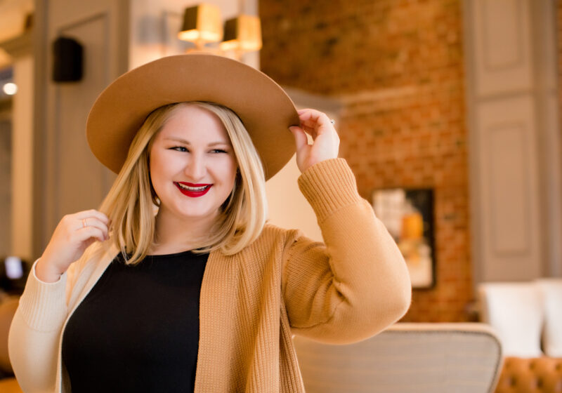 Blonde girl in hat.