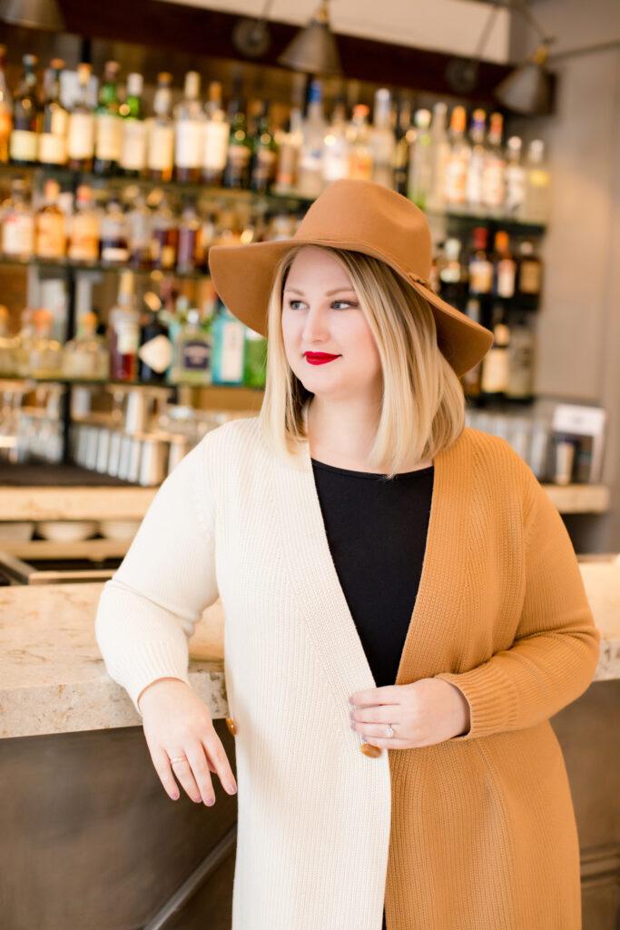 Blonde girl in hat.